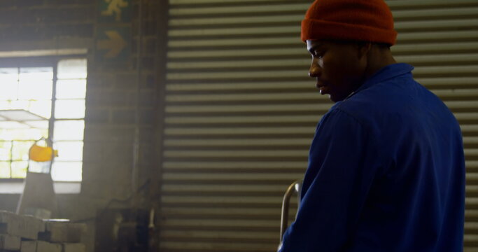 Male worker heating molds in workshop