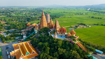 Aerial of  Wat Tham Suea buddhist temple in Kanchanaburi Thailand at sunset
