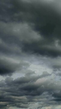 Time lapse of flying grey clouds over horizon, no flicker, no birds.