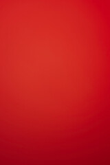 Red vertical background with gradient darkening downwards. Bright festive backdrop, saturated blank for new year, Christmas, Valentine's Day, vivid birthday card.