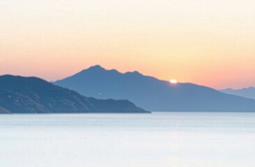 A vibrant sunset casts warm hues over tranquil waters and distant mountains, creating a peaceful coastal atmosphere. Generative AI