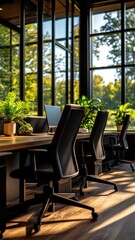 Fototapeta premium A modern office space featuring sleek furniture, large windows, and greenery, creating a bright and inviting work environment.