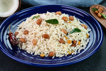Coconut rice spicy Indian dish served in a plate.