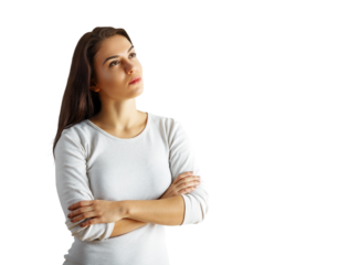 Pensive young woman with arms crossed, wearing a white shirt, gazing upwards thoughtfully. Isolated on a white background, concept of contemplation