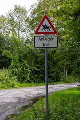A sign with a horse on it and the word &ldquo;Residents Free