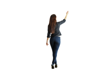 Woman standing with her back turned, wearing casual clothing, gesturing upwards. Isolated on a white background. Concept of direction or teaching