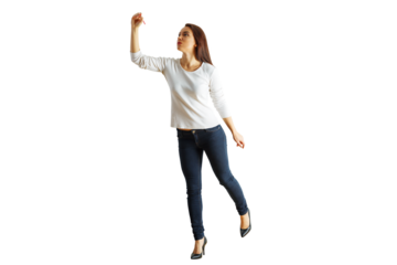 Full-body portrait of a woman in jeans and a white shirt raising her arm. Isolated on white background. Concept of posing or casual modeling