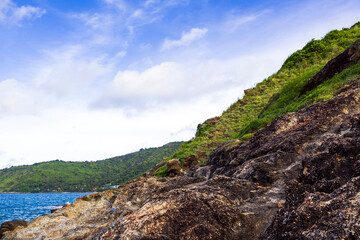Green grass and rock at Yanui Beach in Phuket Thailand