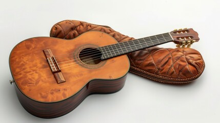 Fototapeta premium A guitar placed next to a neck cushion, representing music as a relaxing hobby, isolated on white