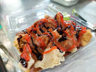 Indonesian food - Batagor is made from fish, tapioca and spices wrapped in dumplings and then fried. Served with spicy peanut sauce