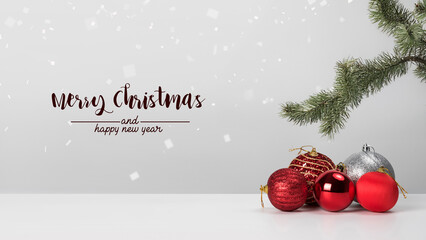 Christmas composition. Christmas balls with red on white background.