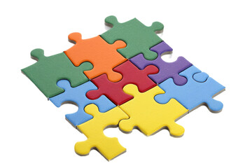 Colorful puzzle pieces arranged in a playful manner on a white background highlighting creativity and problem-solving skills