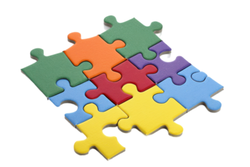 Colorful puzzle pieces arranged in a playful manner on a white background highlighting creativity and problem-solving skills
