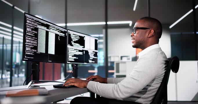 Web Developer Coding On Computer