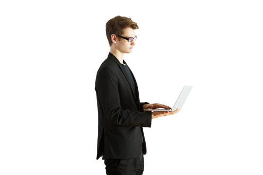 A man in a blazer using a laptop while standing in side profile. Isolated on a white background. Concept of business, technology, and productivity