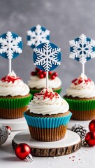 Christmas cupcakes decorated with snowflakes and holiday toppers