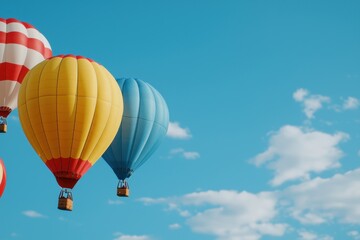 Fototapeta premium A group of hot air balloons are flying in the sky, with one of them being yellow