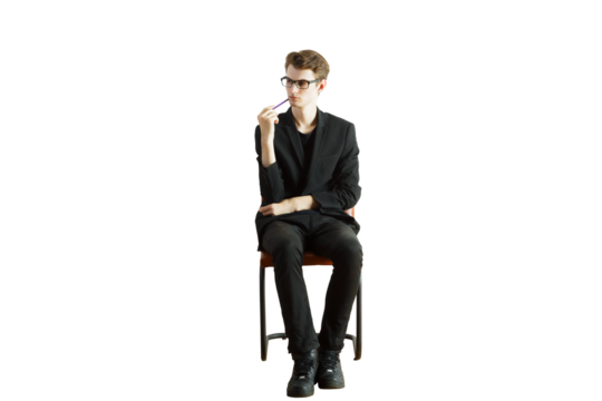 Man inoutfit sitting on a chair, isolated on white background. Clean and minimalistic concept of contemplation, focus, and professionalism
