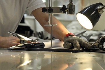 sewing factory sew fabric seamstress knitwear wool hands toy slippers red sewing machine iron...