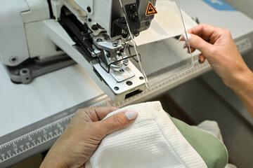 sewing factory sew fabric seamstress knitwear wool hands toy slippers red sewing machine iron...