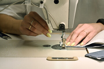 sewing factory sew fabric seamstress knitwear wool hands toy slippers red sewing machine iron...