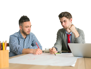 Two young men working together on a project at a desk, one writing on paper and the other analyzing. White background, concept of teamwork