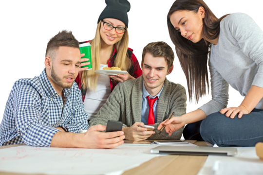 Group of young professionals or students gathered around a table, brainstorming and using technology, isolated on a white background, teamwork concept