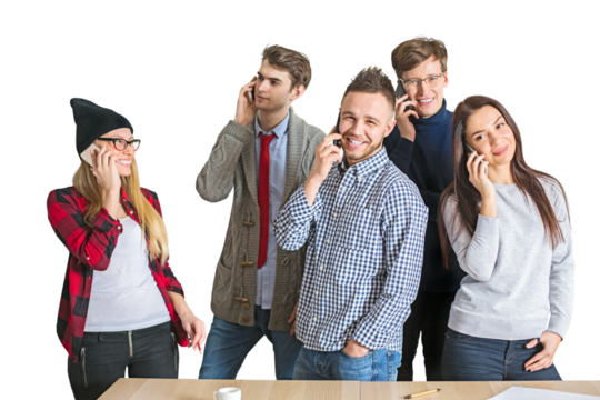 Five young adults smiling, talking on phones, wearing casual clothes, standing close together on a white background, concept of communication