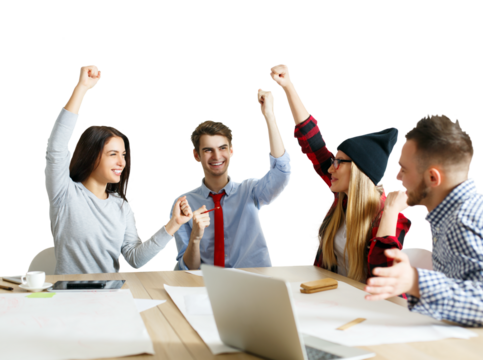 Team of four young people celebrating success at the office table. Bright setting, white background, concept of teamwork and achievement