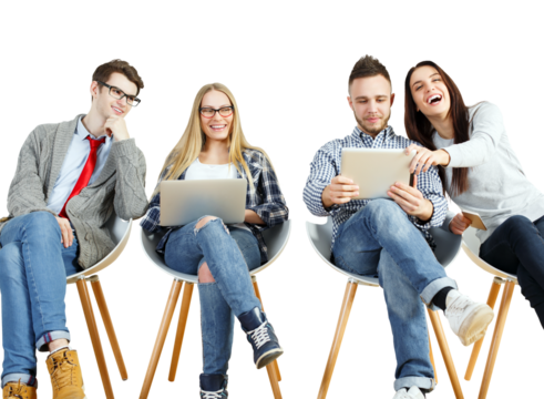 Four young adults sitting on chairs, interacting with laptops and tablets, casual clothing, white background. Concept of teamwork and technology - Powered by Adobe