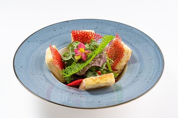 Asian Salad with Tofu and Edible Flower on a Plate Against a White Background