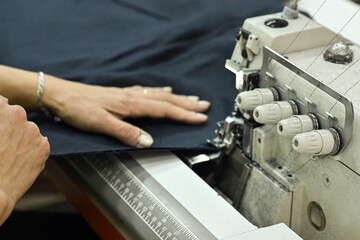 sewing factory sew fabric seamstress knitwear wool hands toy slippers red sewing machine iron ironing blue pattern templates needles carpets scissors cut lamp