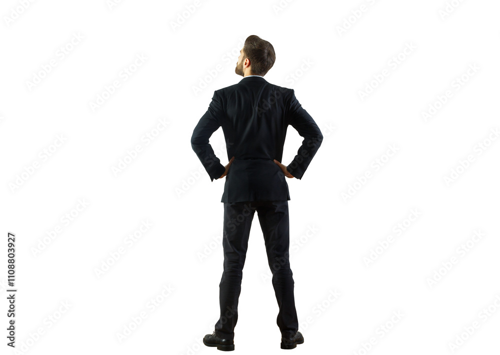 Poster a man in a dark suit viewed from behind, standing with hands on hips, isolated on a clean white back