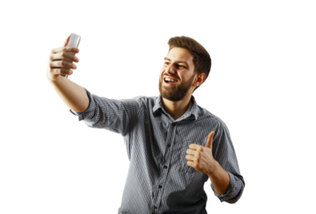 A cheerful man with a beard takes a selfie while giving a thumbs-up gesture, wearing a checkered shirt, isolated on a white background