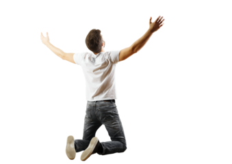 Back view of a man kneeling with arms wide open in a white shirt and jeans on a white background. Concept of freedom and celebration