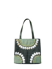A unique female handbag made by hand from natural materials isolated on a white background.