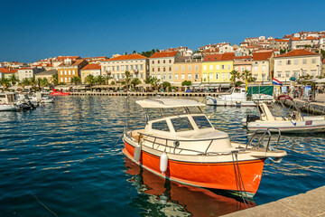 Obraz premium Small boat in the marina of Mali on the island of Losinj in the Adriatic Sea, Croatia