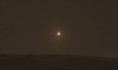 Bright star shining in the night sky over a desolate landscape during a calm evening