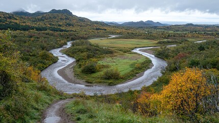 Fototapeta premium Stunning Autumn River Landscape Winding Water Vibrant Foliage Scenic View