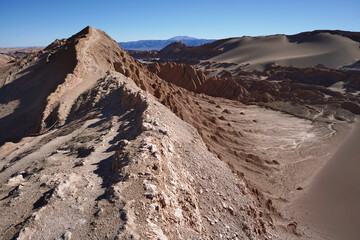 Fototapeta premium Sand and stone landscapes of Valley of the Moon, San Pedro De Atacama, Chile