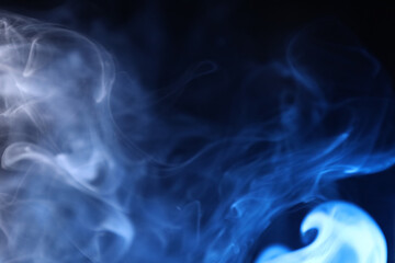 Fototapeta premium White and blue bright lines, green smoke on a dark background, colourful abstract, vibrant fog, minimalism, line of light, blue sky colour