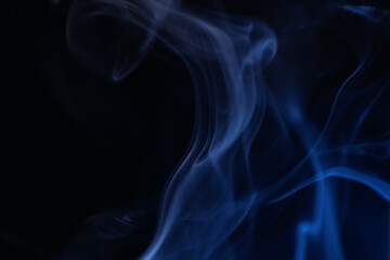 Blue foggy background, smoke on black background, colourful abstract, line of light, perfect light in the darkness 