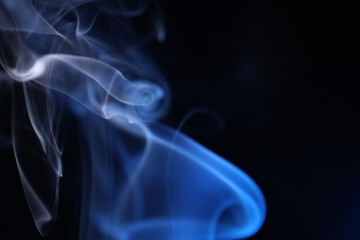 White and blue bright lines, green smoke on a dark background, colourful abstract, vibrant fog, minimalism, line of light	