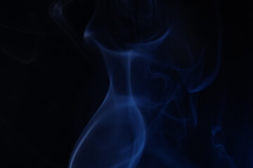 Fototapeta premium Navy blue coloured fog, bright lines, vibrant smoke on the dark background, colourful abstract, blue fog, minimalism, line of light