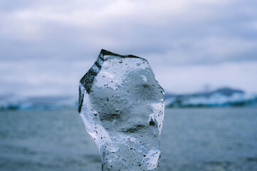Close-up of piece of ice near glacier lake in Iceland. Jokulsarlon. Wild nature.