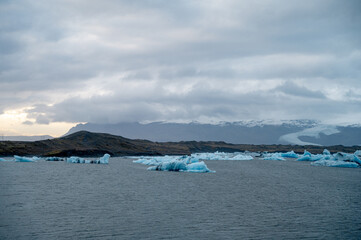 Scenic landscape of Jokulsarlon. Glacial lake in Iceland. Cloudy weather. Icelandic nature. Blue ice...