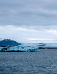 Scenic landscape of Jokulsarlon. Glacial lake in Iceland. Cloudy weather. Icelandic nature. Blue ice...