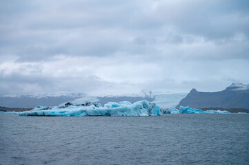Scenic landscape of Jokulsarlon. Glacial lake in Iceland. Cloudy weather. Icelandic nature. Blue ice...