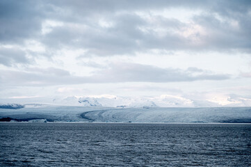 Scenic landscape of Jokulsarlon. Glacial lake in Iceland. Cloudy weather. Icelandic nature. Blue ice...