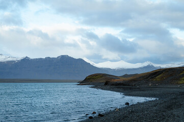 Scenic landscape of Jokulsarlon. Glacial lake in Iceland. Cloudy weather. Icelandic nature. Blue ice...